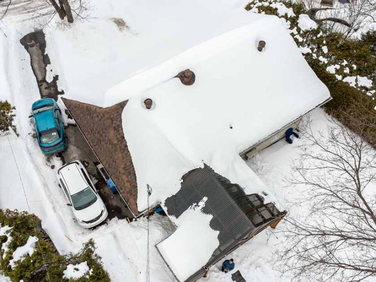 snowy roof needing seasonal maintenance